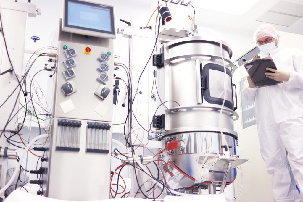 Lab technician working with biopharma equipment